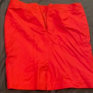 A reddish orange skirt Knee link